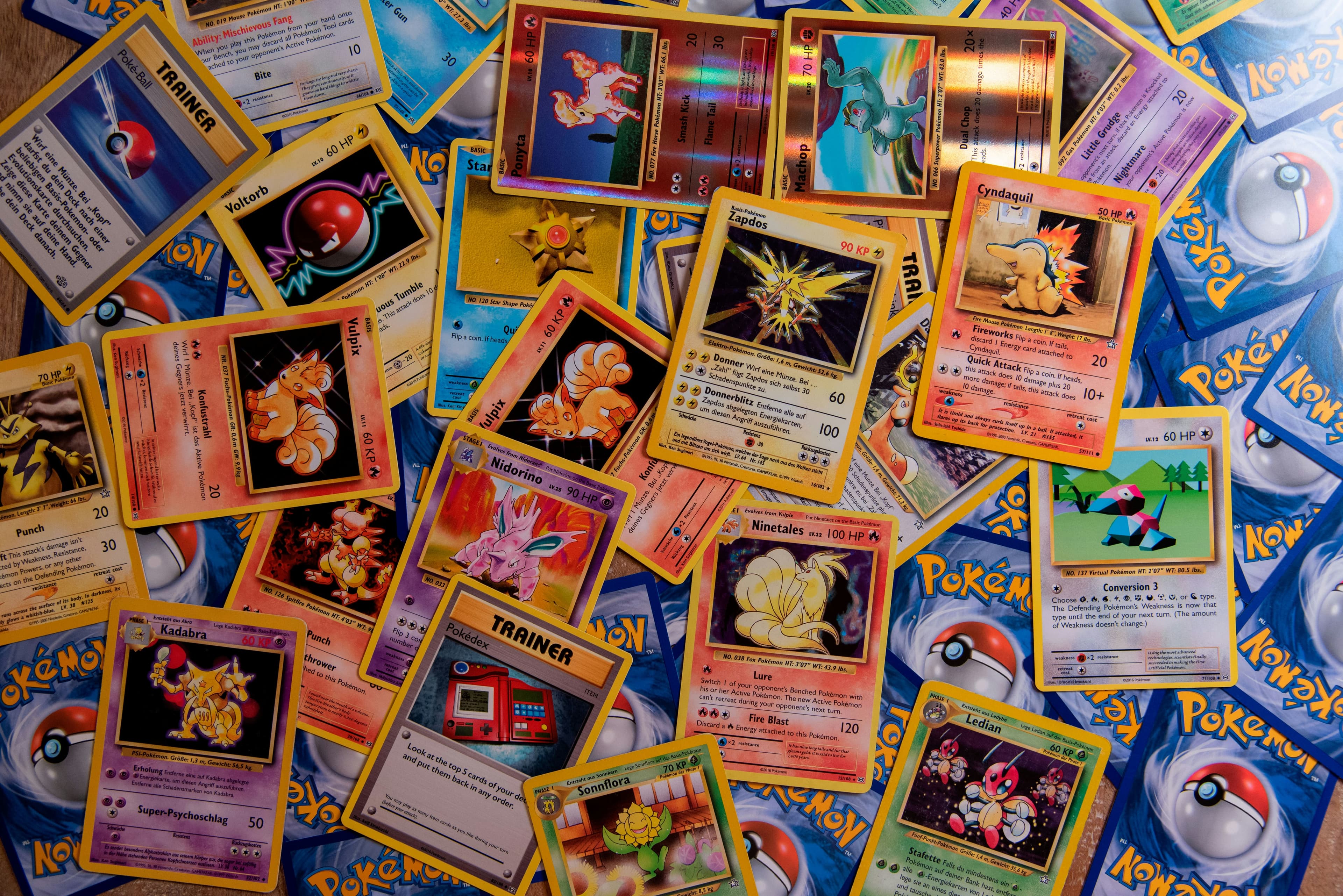 Vintage Pokemon cards scattered across a tabletop.